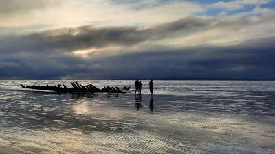 Driftwood on the beach at Pembrey at low tide 